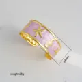 Gold plated open cuff bracelet featuring pink enamel finish, starfish and seahorse motifs, 24mm. - 37