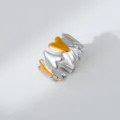 Detail shot of a trendy dual-color stainless steel heart shape open ring fashion accessory. - Heart Patchwork Hip-Hop Style