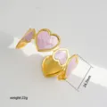 Gold C-shaped open cuff bracelet with pink enamel hearts, elegant fashion jewelry. - 45