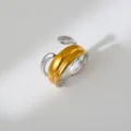 Close-up view of the unique two-tone stainless steel open ring, showing smooth polished details. - Modern Deconstruction Style
