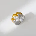 Detail view of a trendy two-tone stainless steel open ring with a chic wave design. - Wavy Deconstructed Style