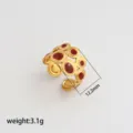 Gold stainless steel open ring with red enamel circles. Detail view showing 12.2mm width, 3.1g. - Style 384