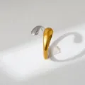 Two-tone stainless steel open ring detail view, modern fluid minimalist jewelry design. - Streamlined Teardrop Style