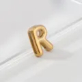 Close-up detail shot of a gold-toned 3D letter R pendant charm, showing polished metallic texture. - Letter R