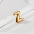 Gold stainless steel letter Z charm close up detail showing smooth polished metal finish. - Letter Z
