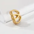 Gold stainless steel geometric pendant charm detail view, high polished shine jewelry piece. - Cross Heart Pattern