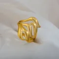 Gold-colored metallic open ring with unique hollow wave design, elegant jewelry accessory for daily. - Streamlined Wavy Abstract Ring / Gold