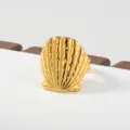 Gold shell ring stylish metal statement jewelry minimalist fashion layered accessory design. - Seashell Style(56)