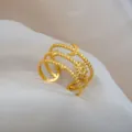 Gold stainless steel adjustable ring featuring multi-strand beaded sun and moon design. - Star Moon Beaded Twisted Ring / Gold