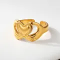 Gold stainless steel hug heart ring variant, elegant interlocking hands design fashion jewelry. - Embracing Heart Style(109)