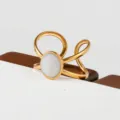 Gold stainless steel ring with white oval stone, modern open stackable fashion jewelry item - Oval White Stone Hollow Style(119)