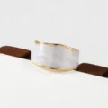 Elegant wide gold-rimmed white cuff bracelet, versatile stainless steel modern jewelry accessory. - Shimmering Texture Wide Style(219)