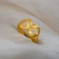 Adjustable stainless steel ring featuring a unique hugging hands heart design in gold finish. - Cupped Hands Holding Heart Ring / Gold