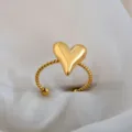 Trendy adjustable stainless steel ring with puffy heart design and twisted band for couples. - 3D Heart Twisted Ring / Gold