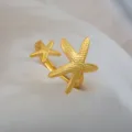 Adjustable stainless steel ring featuring dual gold starfish design, chic ocean jewelry. - Double Starfish Shape Open Ring / Gold