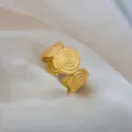 Adjustable gold stainless steel ring with vintage textured circular motif for women men. - Spiral Embossed Wide Ring / Gold