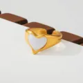 Gold stainless steel heart ring with white insert, adjustable fashion finger jewelry. - Simple White Heart Style(247)