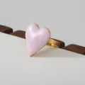 Gold-tone stainless steel ring featuring a stylish pink pearlescent heart charm for daily wear. - Pink Pearlescent Heart Style(281)