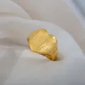 Gold stainless steel adjustable ring with textured heart shape design, vintage open band style. - Heart Embossed Vintage Ring / Gold