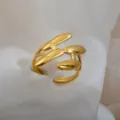 Adjustable gold stainless steel ring featuring a unique abstract pod design for couples. - Abstract Pod And Branch Ring / Gold