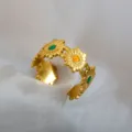 Adjustable gold stainless steel ring featuring cute flower daisy motifs with colorful enamel centers. - Colorful Enamel Daisy Ring / Gold