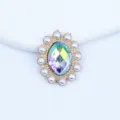 Detail shot of 20x25mm oval pearl sunflower alloy rhinestone button for DIY crafts decoration. - AB Color