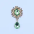 Broche floral de aleacion dorada con estrases colgante cristal verde ovalado DIY. - Verde claro