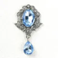 Close-up detail of vintage baroque blue rhinestone brooch pendant DIY fashion jewelry accessory. - Light Blue