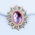 Detailed close-up of gold oval hollow alloy rhinestone DIY jewelry accessory charm. - Light Pink