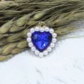 Alloy blue crystal heart pendant with faux pearl border detail shot for DIY jewelry making. - Sapphire Blue