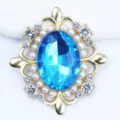 Close-up detail shot of the sparkling blue oval rhinestone alloy DIY flower button accessory. - Lake Blue