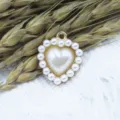 Close-up view of the alloy heart-shaped pearl pendant charm, perfect for DIY jewelry making. - Pearl Color