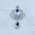 Close-up detail of the sparkling alloy crown rhinestone pendant, perfect for DIY crafts and decor. - White