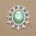Hebilla decorativa de aleación ovalada filigrana resina ojo de gato diamantes para accesorios DIY. - Verde claro