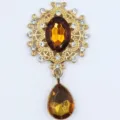 Vintage alloy rhinestone brooch component with amber oval stone and hanging teardrop pendant. - Dark Coffee