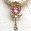 Close-up of gold magical wand pendant with pink heart crystal and pearls for DIY jewelry making. - Light Pink