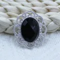 Silver alloy oval filigree decorative buckle with black acrylic rhinestone for DIY jewelry crafts. - Black