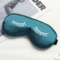 Dark green silk sleep mask with white eyelash print, soft and comfortable for daily travel use. - Dark Green
