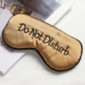 Gold silk sleep mask with black embroidered text Do Not Disturb, soft breathable fabric for travel. - Champagne Gold