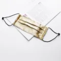 Gold silk face mask with adjustable ear loops, breathable double layer design for summer. - Gold