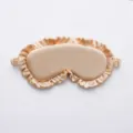 Champagne satin sleep eye mask with elegant ruffled edge and soft elastic band for travel. - Gold