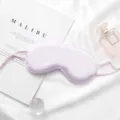 Light purple silk sleep mask with adjustable ear loops for comfortable travel and midday rest. - Light Purple