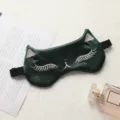 Silk cat sleep mask with cute embroidered eyelashes and soft texture for comfortable travel rest. - Dark Green