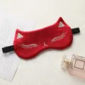 Red silk cat sleep mask with cute embroidered eyelashes and adjustable elastic band. - Festive Red