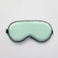 Light green silk sleep mask with black trim, breathable eye cover for comfortable resting - OPP Packaging / Elegant Green