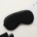 Masque de sommeil noir en imitation soie respirant occultant doux pour un bon repos. - Noir