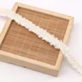 Polyester Chanel-style lace trim for DIY garment accessories, crafts, and decorative sewing. - White
