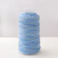Light blue shimmer craft thread spool for DIY handmade bracelets and weaving projects. - Misty Blue Gradient