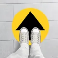 Social distancing yellow floor sticker with black arrow for supermarket public place detail view. - XG019 5 Sheets