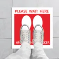 Social distancing floor sticker with shoe prints and safety warning text for public queues. - XG014 5 Sheets